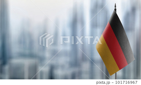 Small flags of the Germany on an abstract blurry background 101716967