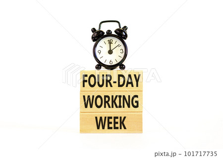 Four-day working week symbol. Concept words Four-day working week on wooden block on a beautiful white table white background. Black alarm clock. Business four-day working week concept. Copy space. 101717735