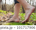 Lifestyle barefoot walk on grass in forest 101717906