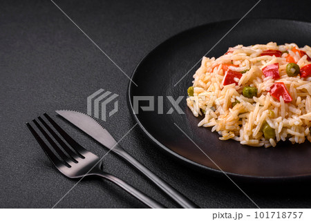 Delicious boiled rice with vegetables peppers, carrots, peas and asparagus beans 101718757