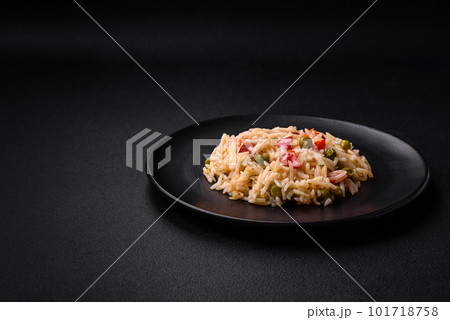 Delicious boiled rice with vegetables peppers, carrots, peas and asparagus beans 101718758