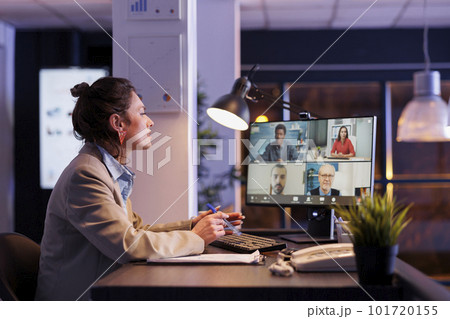 Busiensswoman having remote discussion with business team, discussing marketing statistics. Colleagues planning financial strategy to increase profit, working overtime in startup office Busiensswoman having remote discussion with business team, discussing marketing statistics. Colleagues planning financial strategy to increase profit, working overtime in startup office 101720155