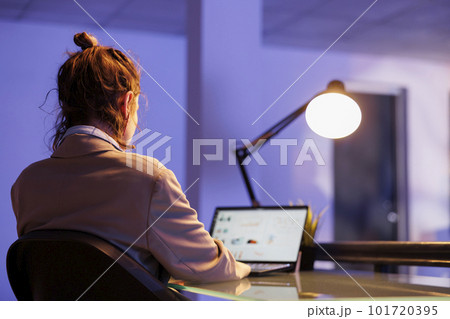 Entrepreneur analyzing company statistics working at financial growth report, overtime in startup office. Executive manager planning investment strategy to increase company profit. Business concept Entrepreneur analyzing company statistics working at financial growth report, overtime in startup office. Executive manager planning investment strategy to increase company profit. Business concept 101720395