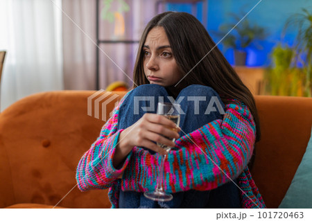 Sad depressed young woman girl suffers from unrequited love, drinking champagne, problem, bad news Sad depressed young woman girl suffers from unrequited love, drinking champagne, problem, bad news 101720463