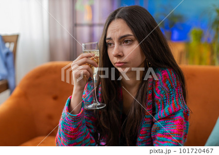 Sad depressed young woman girl suffers from unrequited love, drinking champagne, problem, bad news Sad depressed young woman girl suffers from unrequited love, drinking champagne, problem, bad news 101720467