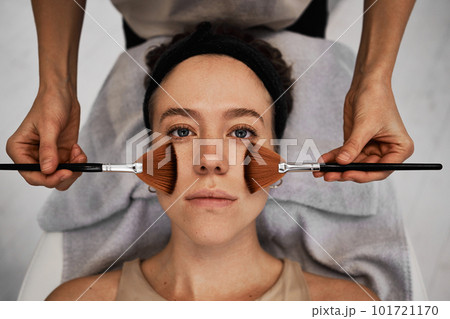 Facial skincare using gadgets and serums for smoother, moisturized skin and reduced wrinkles. Facial skincare using gadgets and serums for smoother, moisturized skin and reduced wrinkles. 101721170