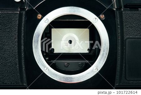 Close up of mirror shutter on SLR single lens reflex or film camera 101722614