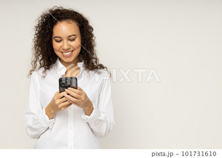 Young woman with phone on white background Young woman with phone on white background 101731610
