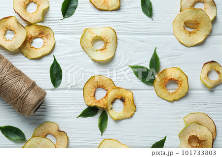Concept of tasty food, dried apple chips, top view Concept of tasty food, dried apple chips, top view 101733803