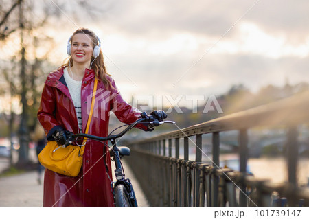 woman listening to music and walking outside in city woman listening to music and walking outside in city 101739147