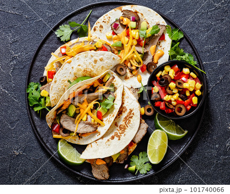 Beef Steak Tacos with veggies, avocado, corn 101740066