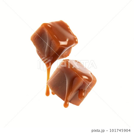 Caramel candy with caramel topping on white backgrounds 101745904