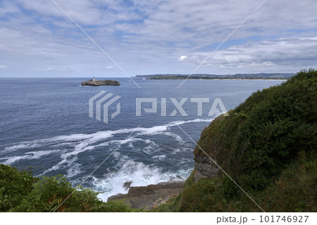 A lighthouse on the Cantabrian Sea coast, and coast line 101746927