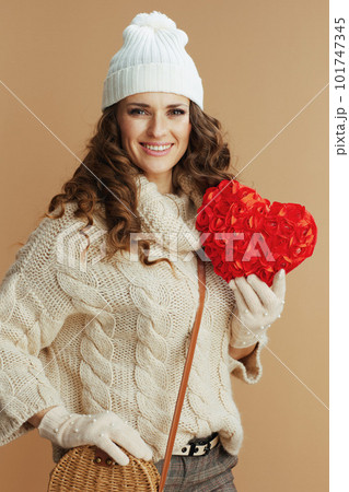 smiling trendy female isolated on beige background 101747345