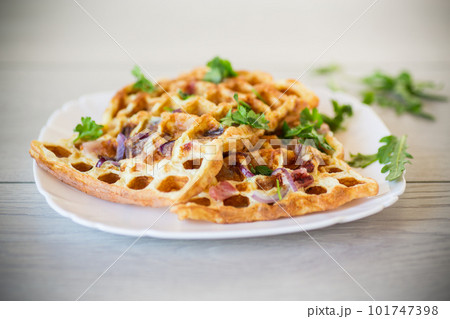 Egg omelette stuffed with onions and herbs, fried in the form of waffles Egg omelette stuffed with onions and herbs, fried in the form of waffles 101747398
