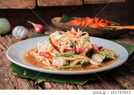Close up, (som Tam) Thai Papaya Salad, with side dishes that can be eaten together perfectly. Close up, (som Tam) Thai Papaya Salad, with side dishes that can be eaten together perfectly. 101747653