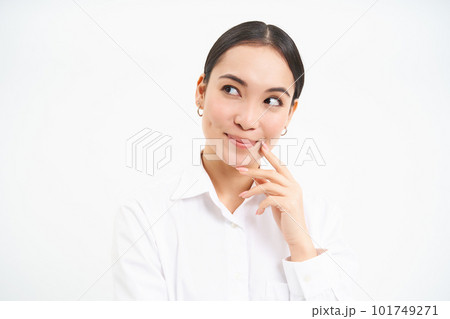 Thoughtful asian female manager, businesswoman standing thoughtful and confident against white studio background 101749271