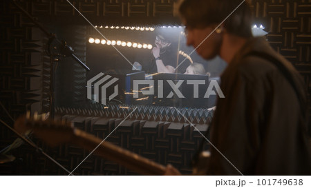 Musical band records album in soundproof room Musical band records album in soundproof room 101749638