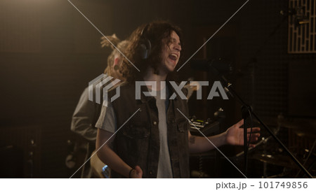 Vocalist makes visual moves and sings in studio 101749856