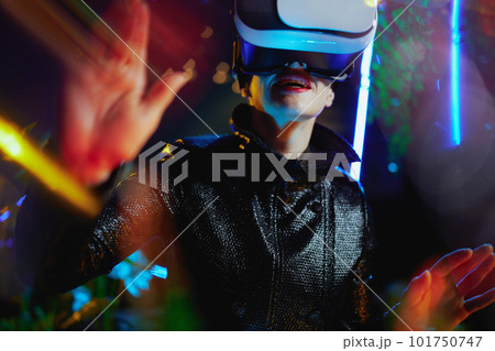 trendy 40 years old woman in metaverse in vr goggles trendy 40 years old woman in metaverse in vr goggles 101750747