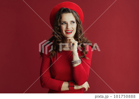 smiling modern female in red dress and beret smiling modern female in red dress and beret 101750888