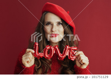 smiling modern woman in red sweater and beret smiling modern woman in red sweater and beret 101751129