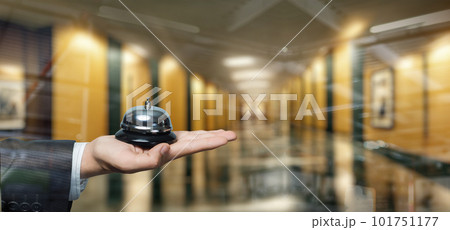 Hand shows a bell for the reception . 101751177