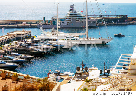 Large sailboat with powerful masta and several sailors on desk are preparing to leave Large sailboat with powerful masta and several sailors on desk are preparing to leave 101751497