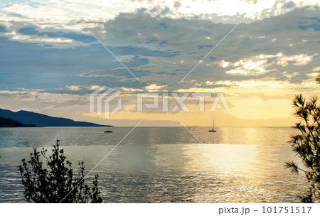 Morning saiboat move (by motor) in waterof Mediterranean Sea) towards to Nice Morning saiboat move (by motor) in waterof Mediterranean Sea) towards to Nice 101751517