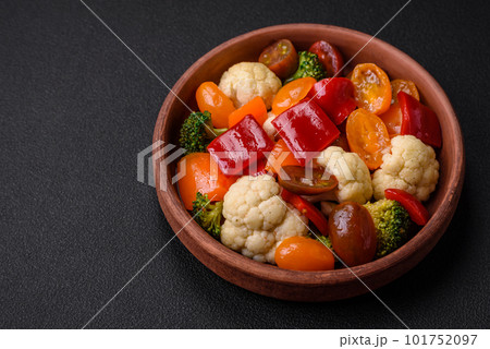 Delicious salad of fresh cherry tomatoes, sweet peppers, broccoli and cauliflower Delicious salad of fresh cherry tomatoes, sweet peppers, broccoli and cauliflower 101752097