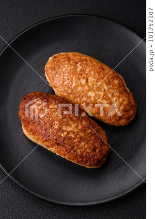 Delicious fried cutlets or meatballs from minced fish with spices and herbs 101752107