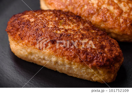 Delicious fried cutlets or meatballs from minced fish with spices and herbs Delicious fried cutlets or meatballs from minced fish with spices and herbs 101752109