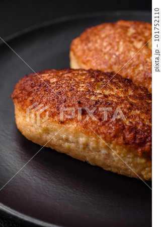 Delicious fried cutlets or meatballs from minced fish with spices and herbs Delicious fried cutlets or meatballs from minced fish with spices and herbs 101752110