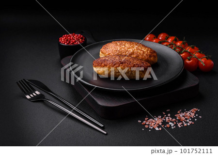 Delicious fried cutlets or meatballs from minced fish with spices and herbs Delicious fried cutlets or meatballs from minced fish with spices and herbs 101752111