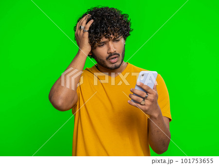 Indian man use smartphone typing browsing loses becoming surprised sudden lottery result bad fortune 101753655