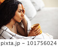 Woman experiencing severe headache due to problems and stress. 101756024