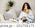 A young girl caught a cold and is being treated at home. 101756175