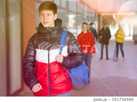 Teenager walking in the street 101756990