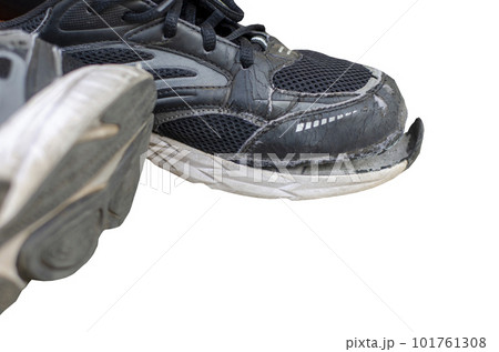 broken old black sneakers isolated on white background with clipping path broken old black sneakers isolated on white background with clipping path 101761308