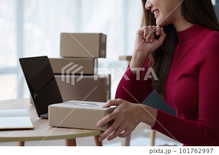 Small businesses SME owners female entrepreneurs check online orders to prepare to pack the boxes, sell to customers, sme business ideas online 101762997