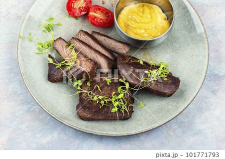 Fried ostrich steaks. 101771793