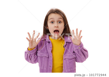 Isolated portrait on white background of a scared beautiful child girl, with afraid look, open mouth and hands palms, screaming looking to camera, expressing fright Isolated portrait on white background of a scared beautiful child girl, with afraid look, open mouth and hands palms, screaming looking to camera, expressing fright 101772944