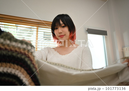 Asian female fashion designers working on new collection at home office. Online seller, business and technology 101773136