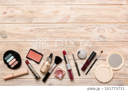 Professional makeup tools. Top view. Flat lay. Beauty, decorative cosmetics. Makeup brushes set and color eyeshadow palette on table background. Minimalistic style 101773731