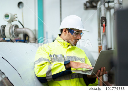 Professional Asian mechanical engineer inspecting the machines in the automated manufacturing factory. Expertise occupation concept. 101774383