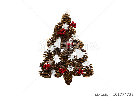 Isolated Christmas tree made from natural cones on colored background, view from above. New Year minimal concept with copy space Isolated Christmas tree made from natural cones on colored background, view from above. New Year minimal concept with copy space 101774733