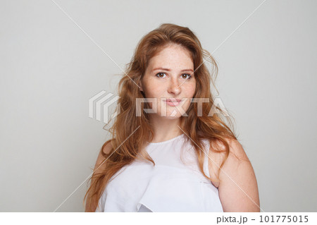 Perfect young redhead woman with wavy hairstyle portrait Perfect young redhead woman with wavy hairstyle portrait 101775015