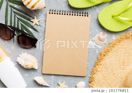 Blank writing book with summer beach accessories on background, copy space. Flat lay with copy space Blank writing book with summer beach accessories on background, copy space. Flat lay with copy space 101776851