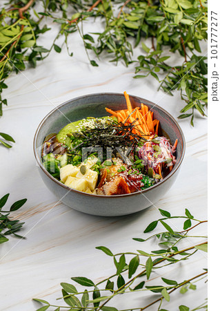 Portion of eel poke bowl with vegetables 101777277
