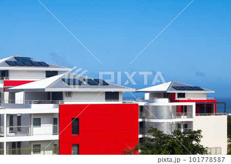 Condominiums with solar panel on their roofs 101778587